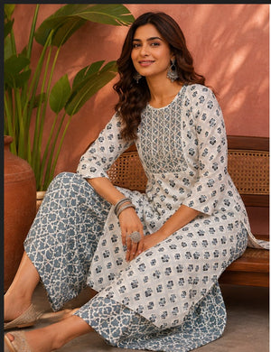 White floral V-neck tassel kurti with striped pant set