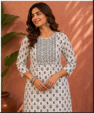 White floral V-neck tassel kurti with striped pant set